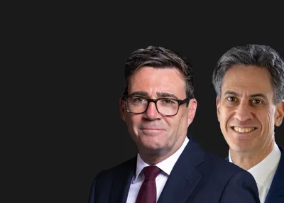 Profile of Prime Minister, Andy Burnham, and Foreign Secretary, Ed Miliband on a plain black banner.