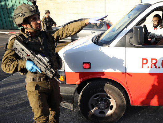 PRCS ambulance teams try to reach the scene where three Palestinians were shot in Nablus