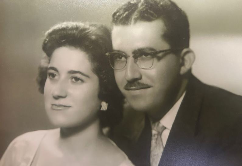 Portrait photo of Marwan's parents, looking out to the distance with a smile.