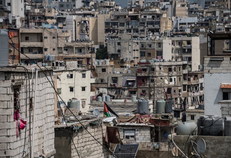 A Palestinian flag flies from a rooftop in Shatila camp.