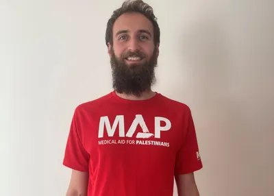 Photo of MAP supporter, Michael Battye, wearing a red MAP t-shirt.