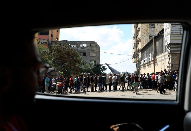 People line the streets of northern Gaza.