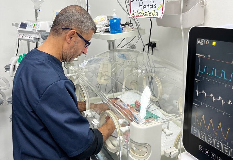 A healthcare workers in the neonatal intensive care unit at the Patient's Friends Benevolent Society Hospital in Gaza City.